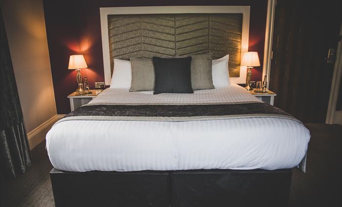 A double bed in a hotel bedroom.